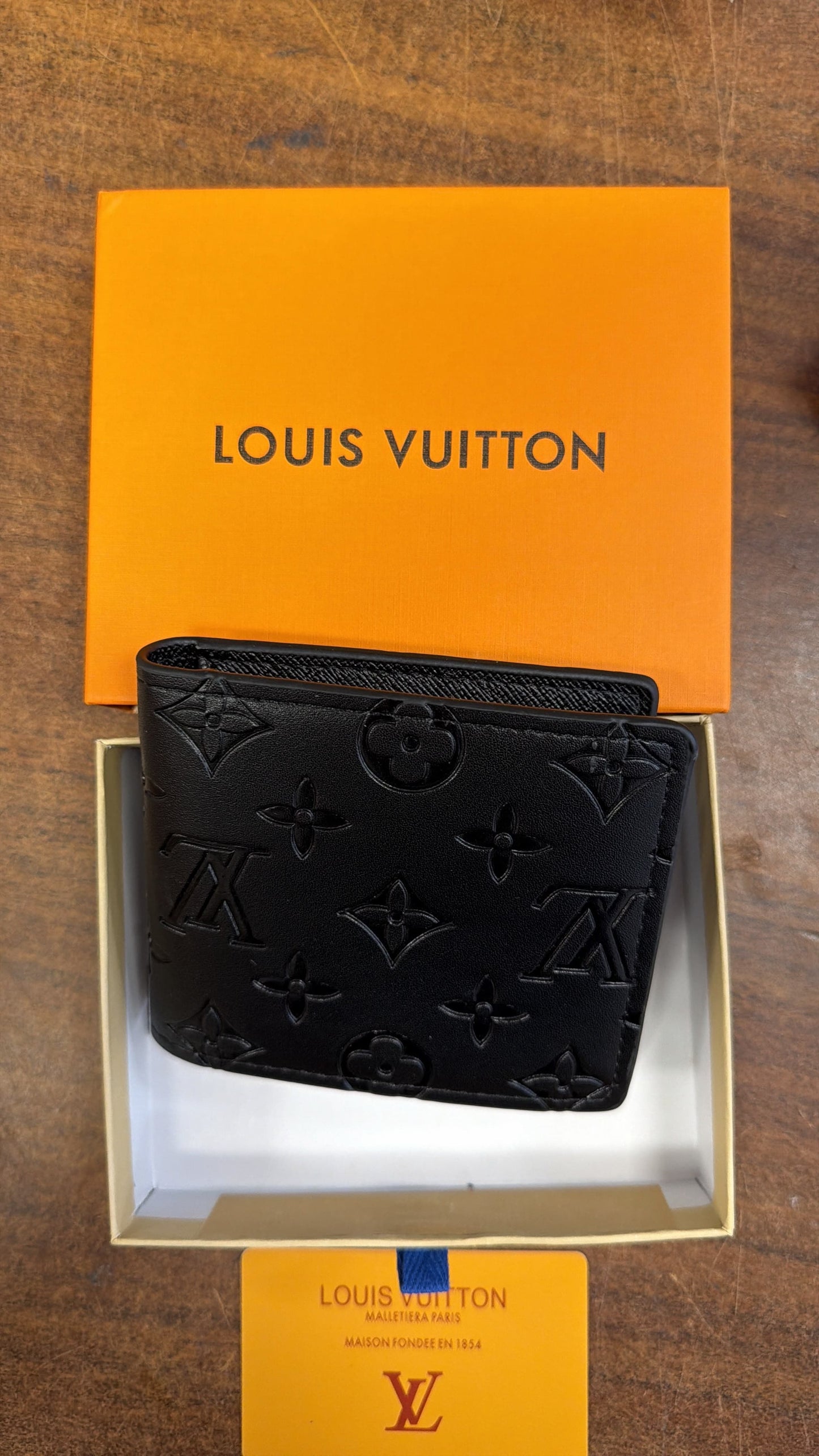 Louis Vuitton Monogram Embossed Bifold Wallet — Black